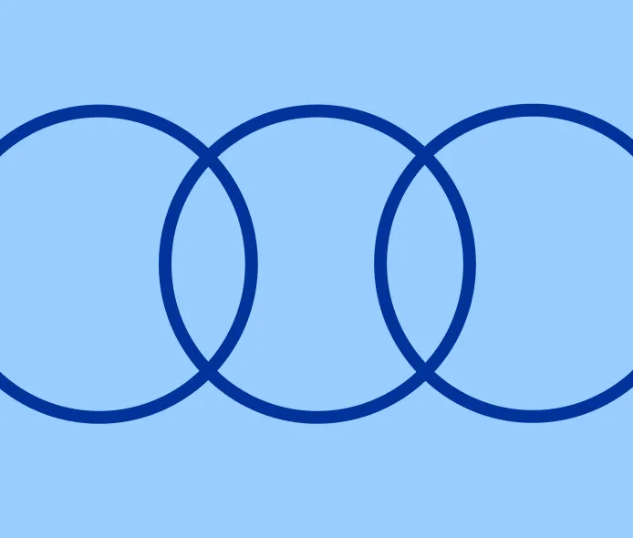 Three overlapping blue rings on a light blue background.