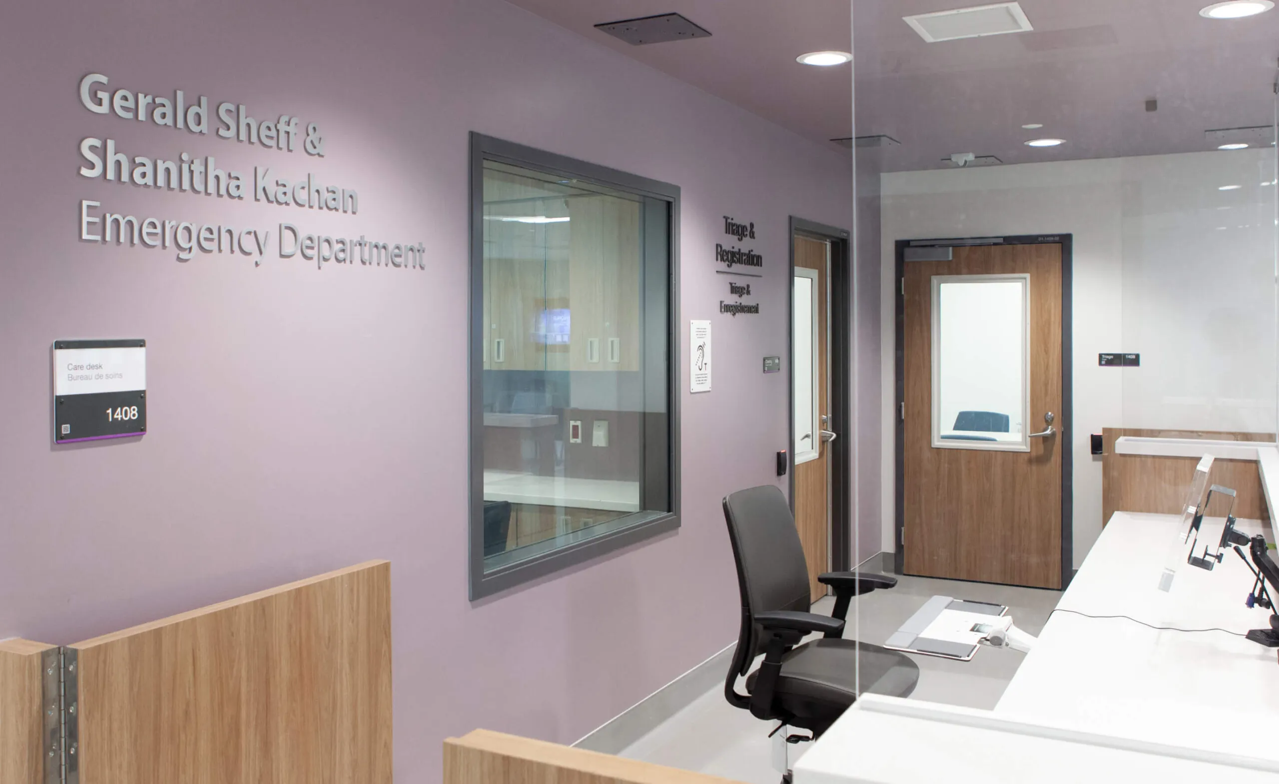 Interior view of the Gerald Sheff & Shanitha Kachan Emergency Department with signage and doors.