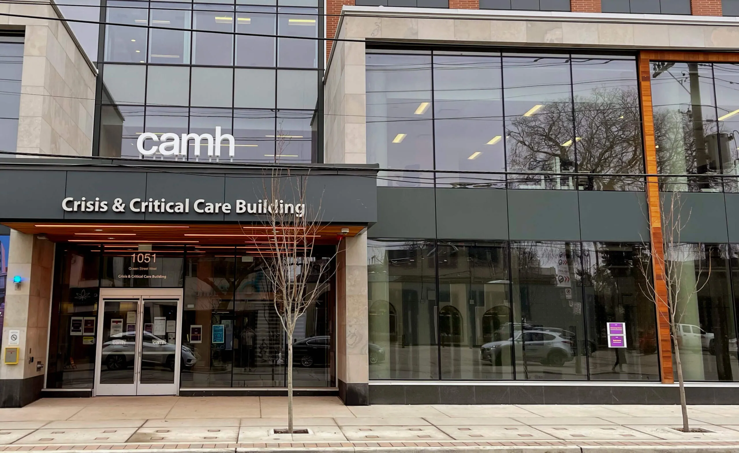 CAMH Crisis & Critical Care Building entrance with glass facade and signage.