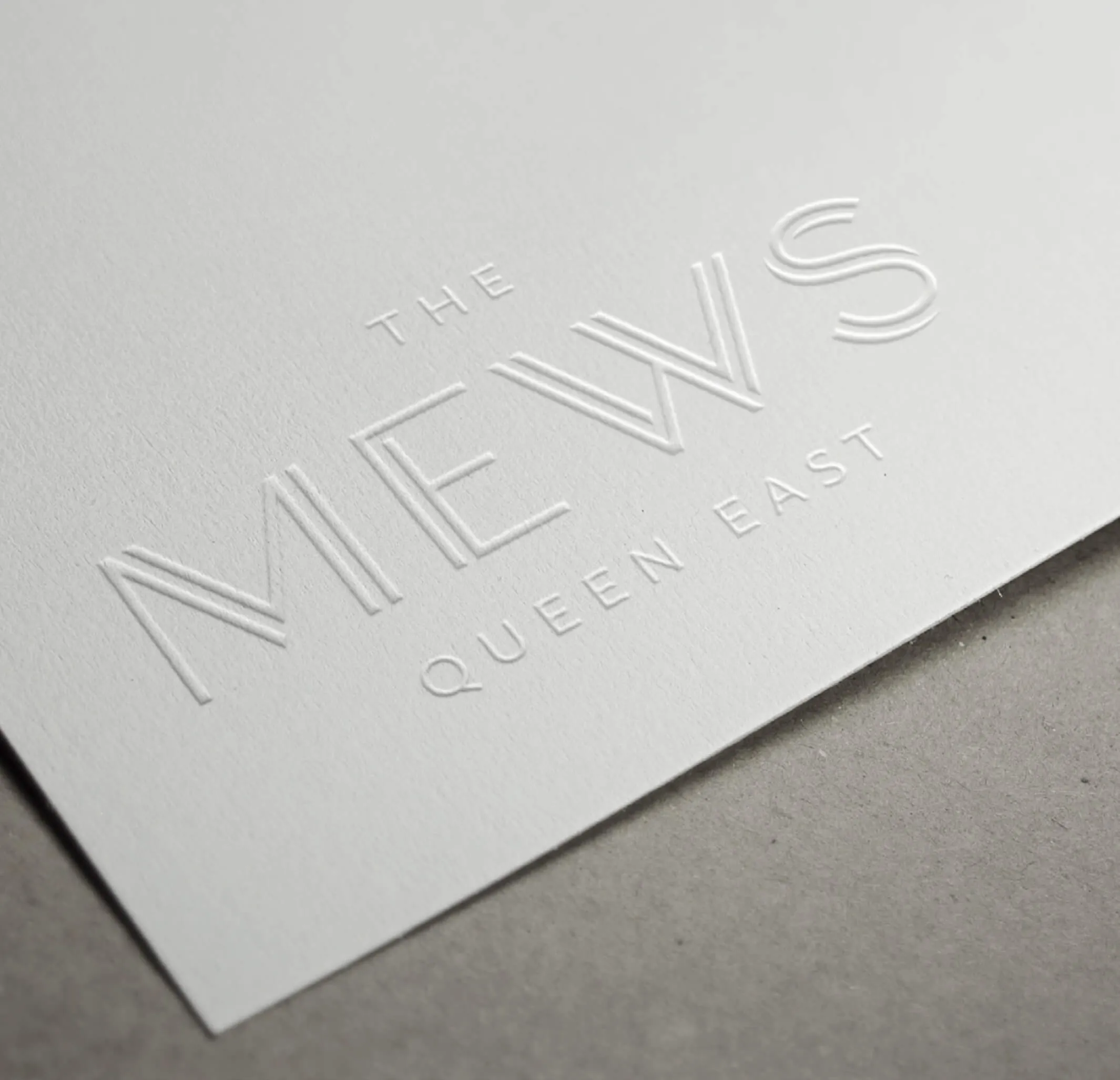 The Mews Queen East logo