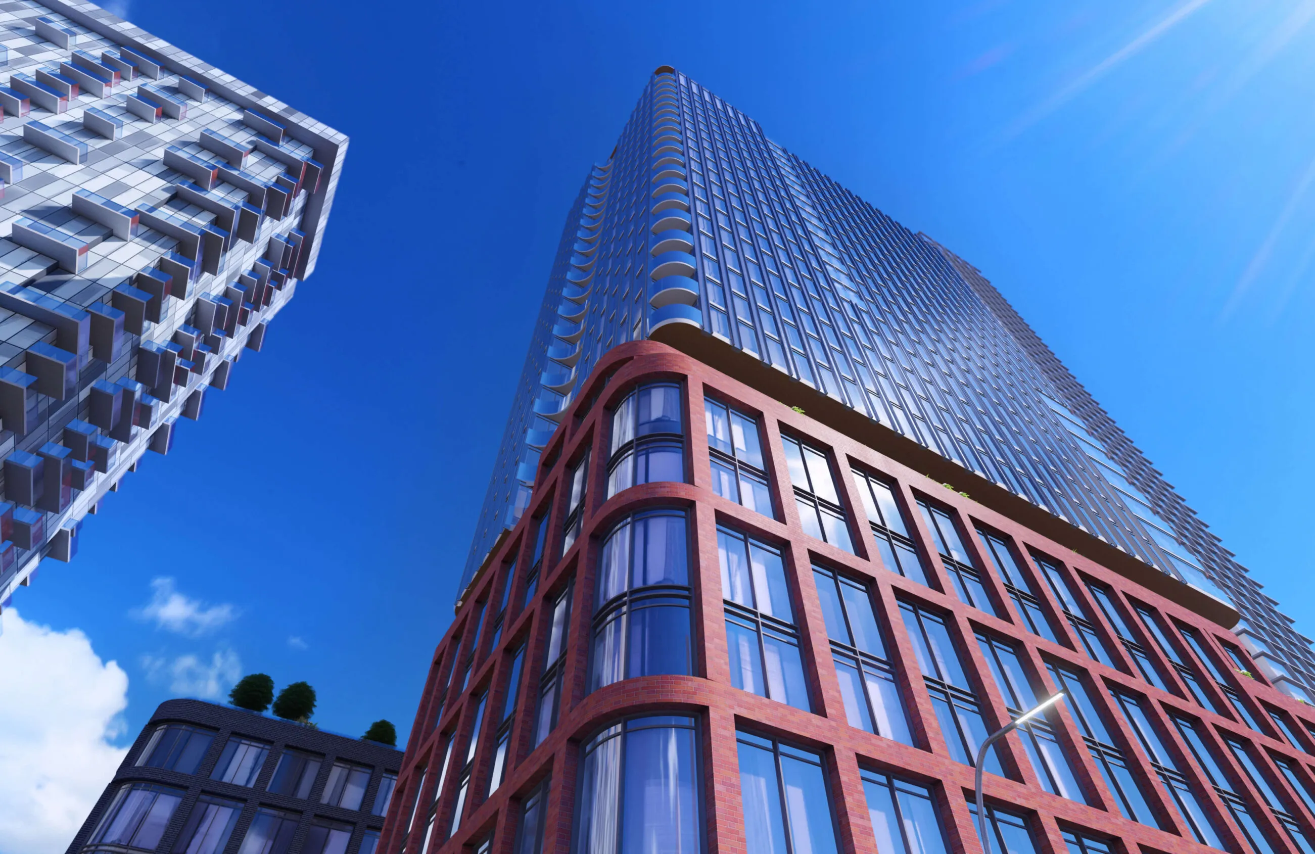 Modern glass and brick skyscrapers against a bright blue sky.