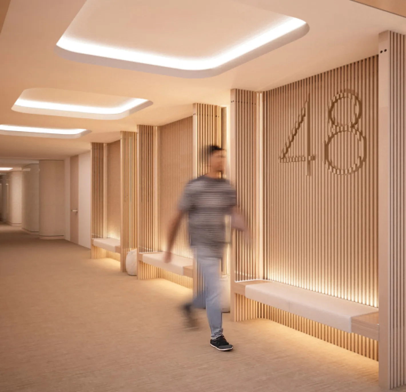 Modern hallway with wood paneling, illuminated ceiling, and a person walking past the number 48.
