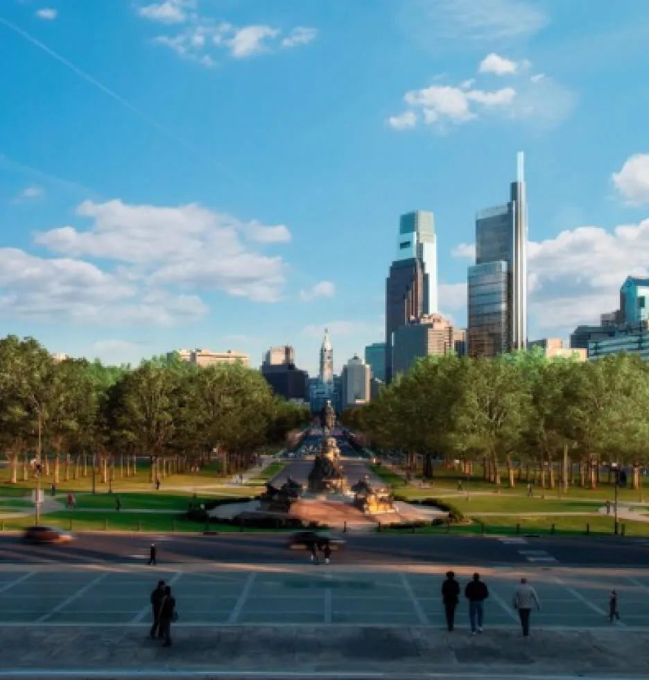 Philadelphia skyline with trees and a fountain in the foreground.